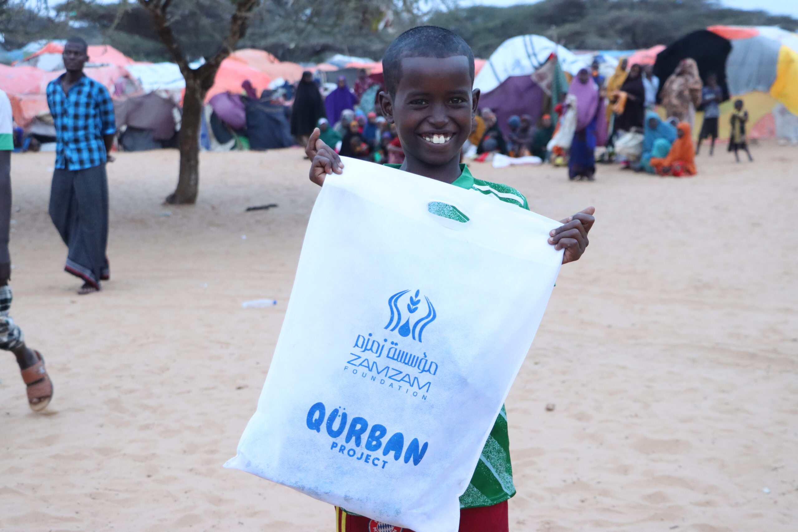 Qurbani 25 main spreading smiles picture boy in IDP camp Qurbani 2025